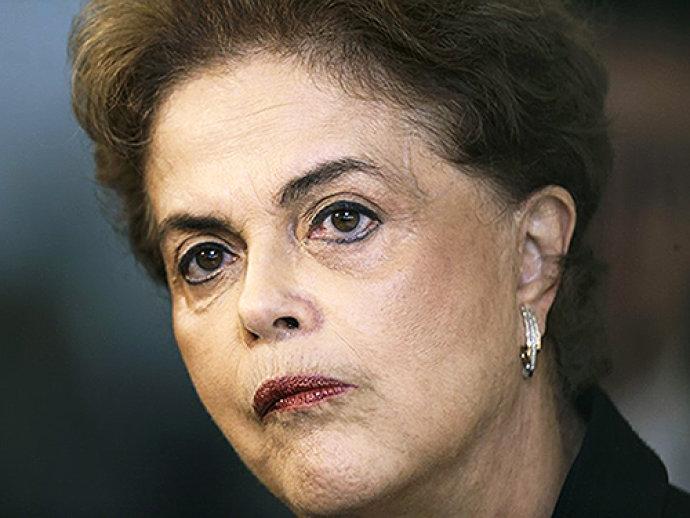 Dilma evoca 'segurança nacional' e diz que no exterior 'quem grampeia presidente vai preso'